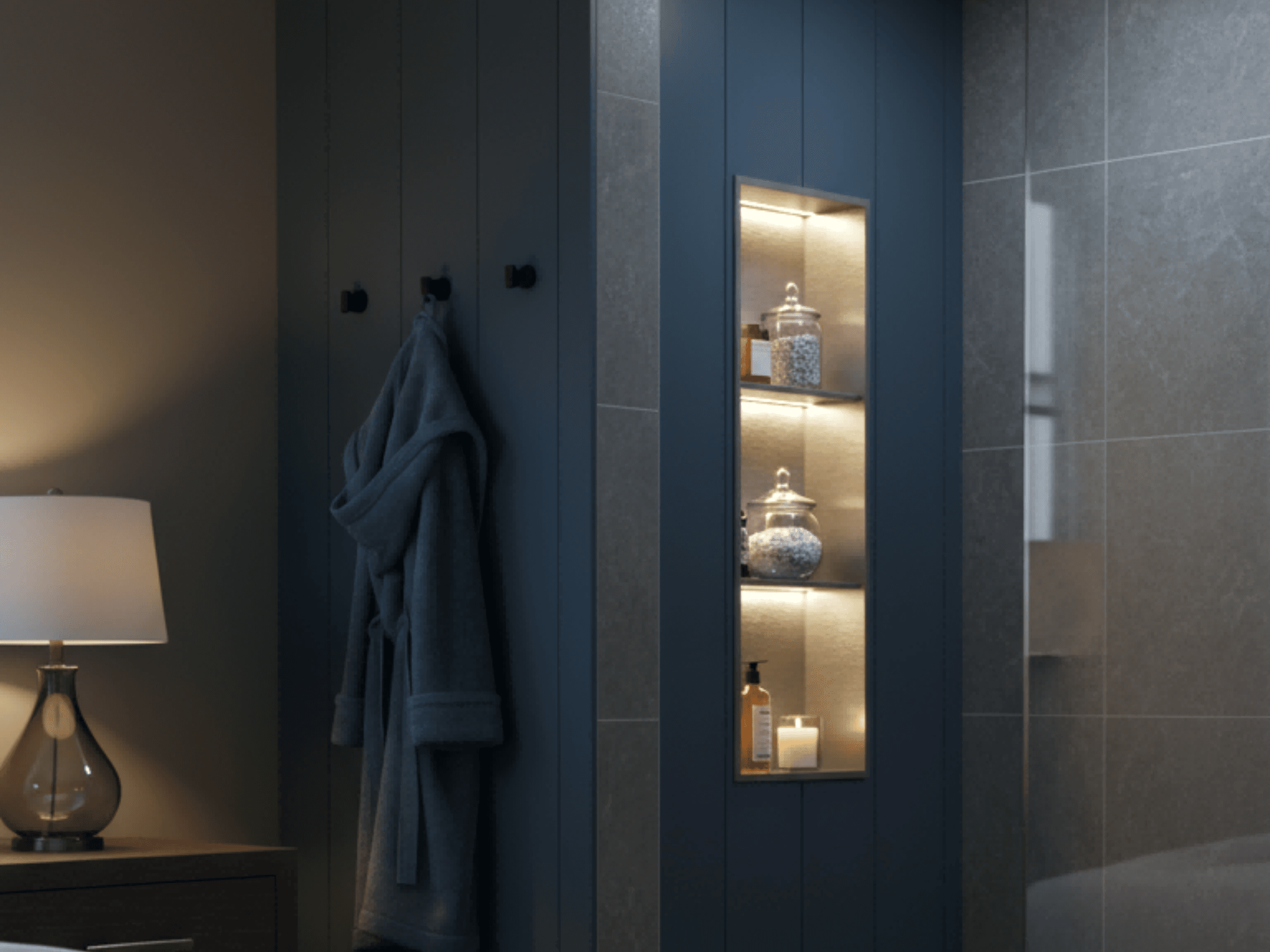 Black LED shower niche OEM series recessed into a dark bathroom wall, using warm integrated lighting to create layered storage display and a relaxed spa-like ambience.