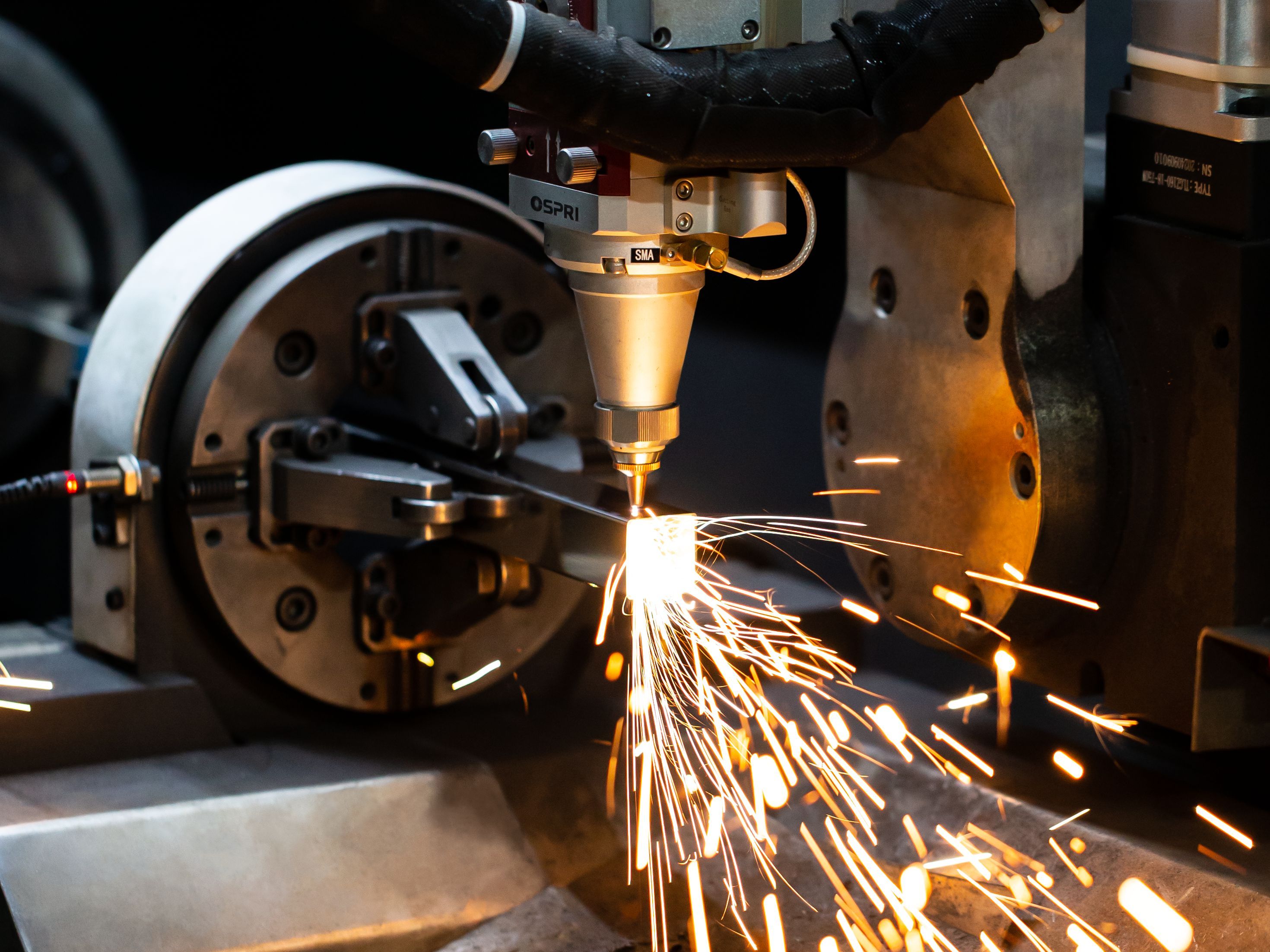 Laser cutting machine operating on stainless steel sheets, demonstrating AussieSteel’s micron-level precision and smooth cutting edges.