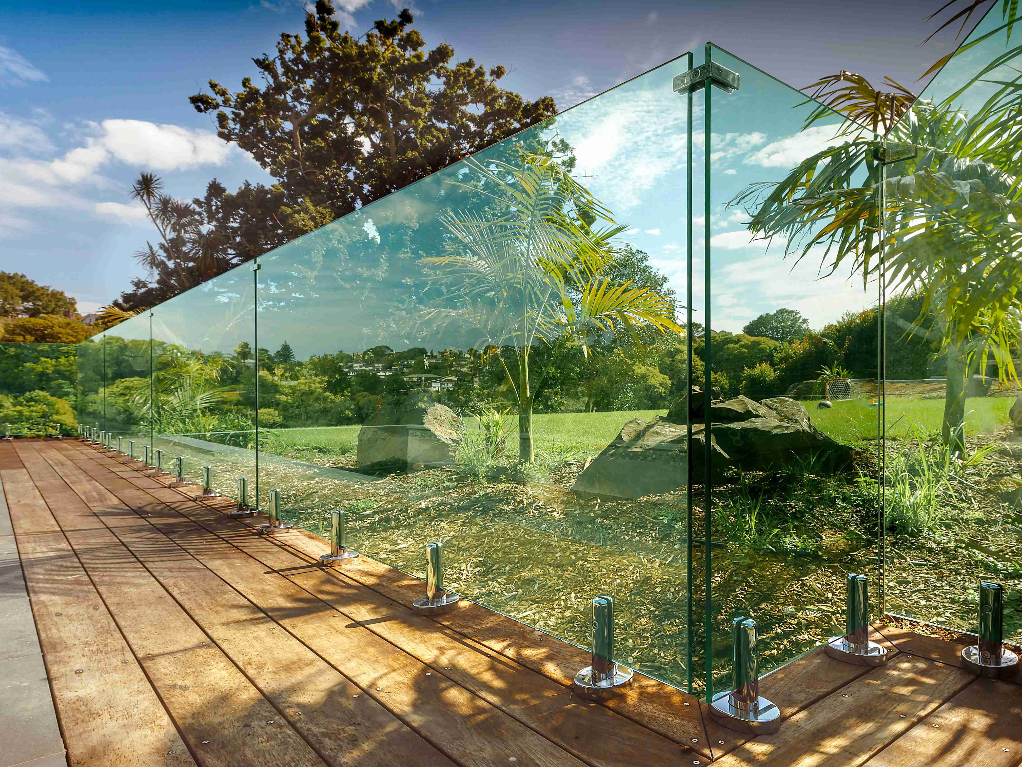 AussieSteel stainless steel pool fence system with glass panels and polished posts, showing outdoor corrosion-resistant structure and precision OEM craftsmanship.