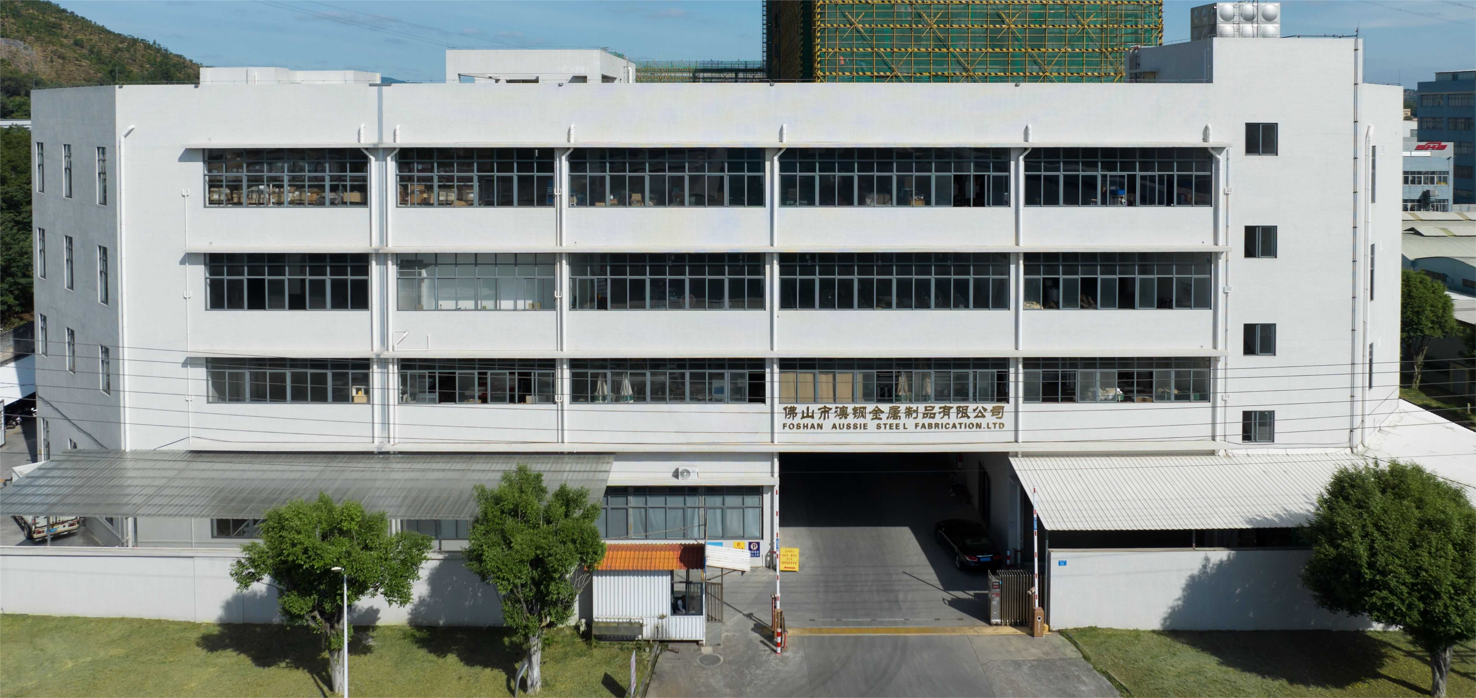 Front entrance of Foshan AussieSteel Metal Products Co., Ltd factory, showing the modern industrial building with company signage, located in Nanhai District, Foshan, China.