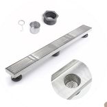 Slotted linear floor drain with TIG-welded frame and brushed finish, engineered for high-flow surface drainage.